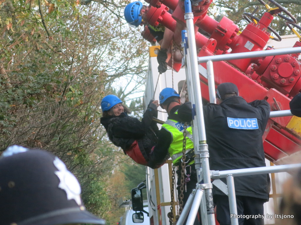 Campaigner abseils from rig lorry