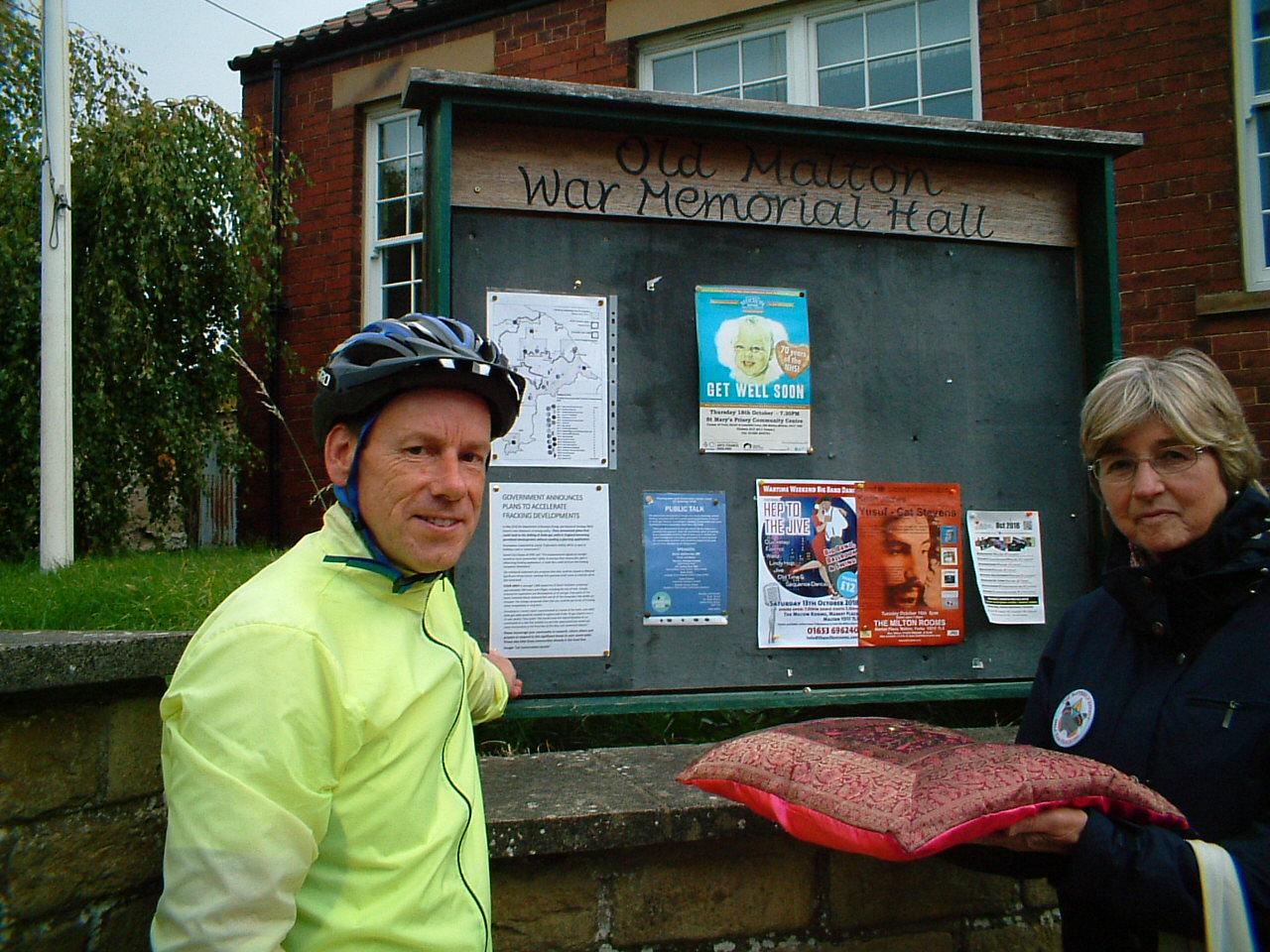 A ceremonial pinning of the final poster in Old Malton